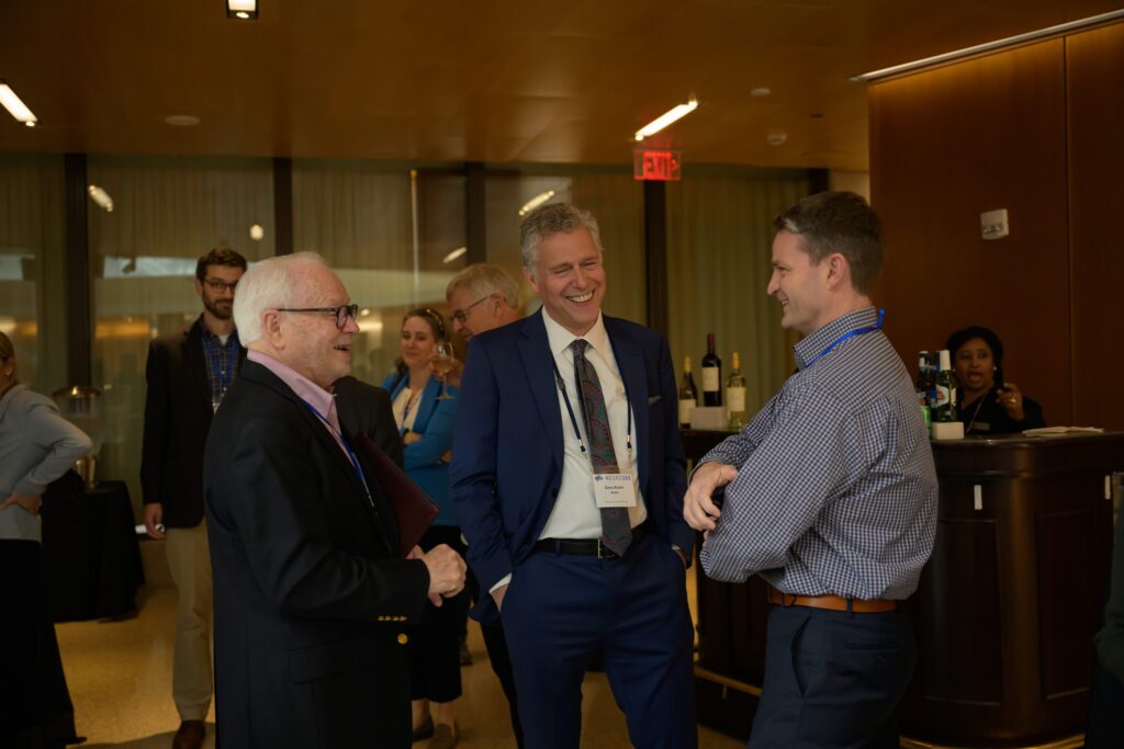 NEURO360 Symposium attendees talking during reception