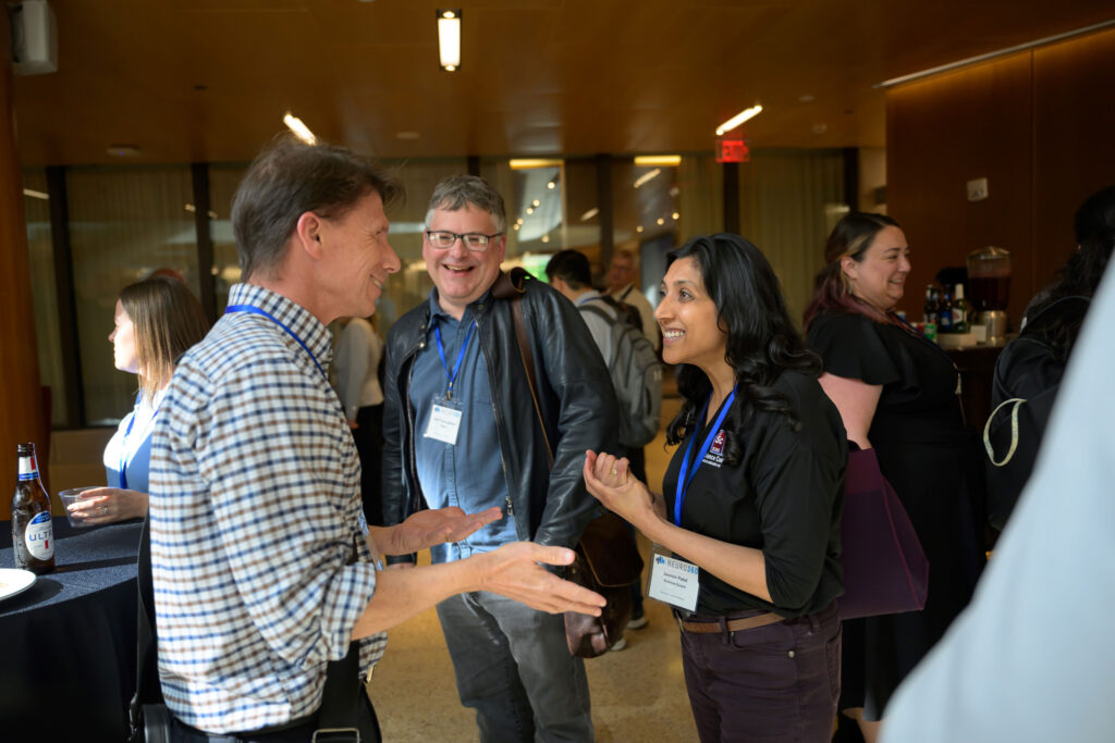 NEURO360 Symposium attendees talking during reception